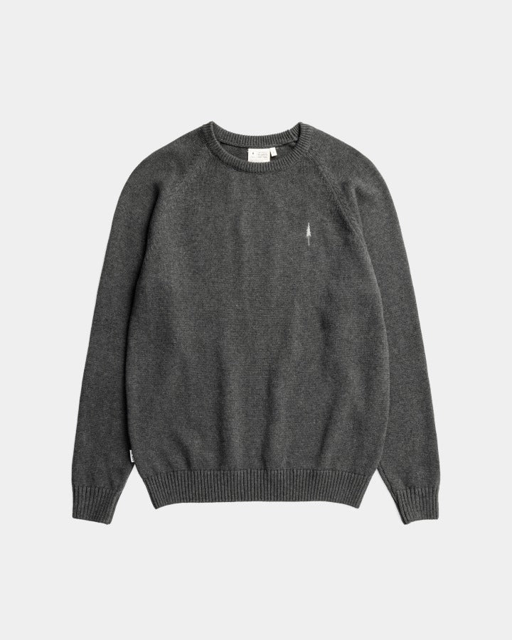 The Urban Explorer TreePullover: a dark gray crew neck sweater with ribbed cuffs and hem, plus a small white embroidered logo on the left chest, shown against a light background—ideal for city adventurers.