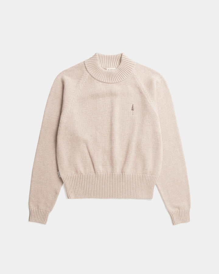 The Women's Cosy Knit TreePullover in beige is laid flat on a white background, showing ribbed cuffs, hem, collar, and a small embroidered tree logo on the left chest.